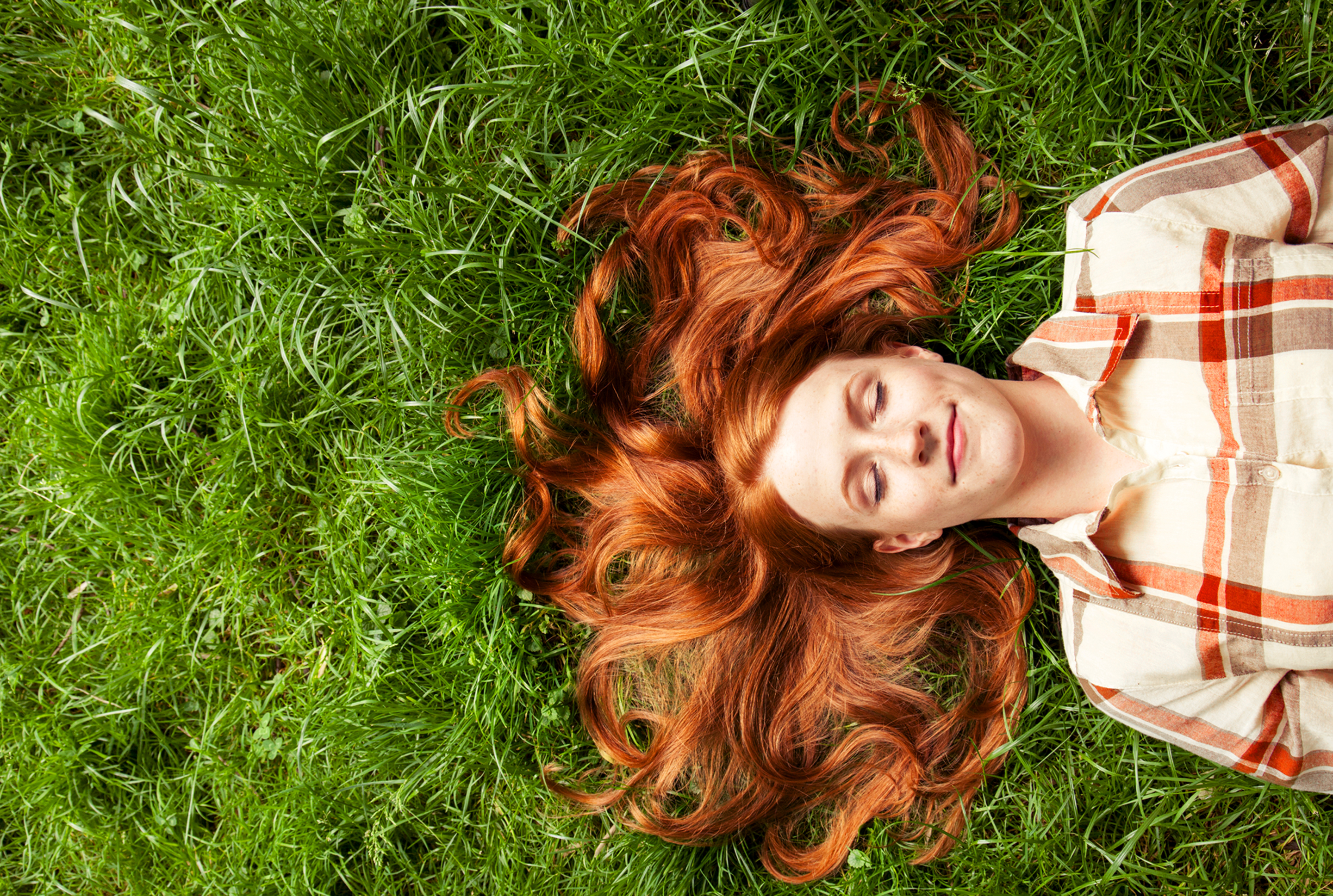 Woman laying in the grass